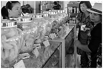 Women buying eddible birds nest. Con Dao Islands, Vietnam ( black and white)