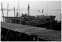 Pier and fishing boats, Nhat Le River, Dong Hoi. Vietnam ( black and white)