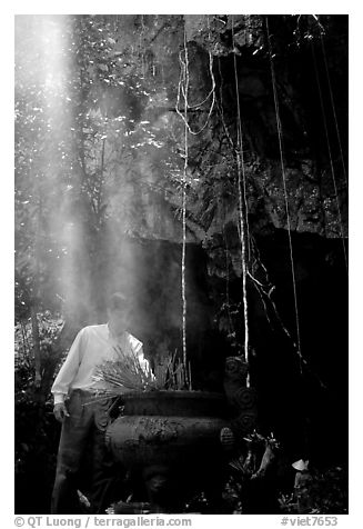 Urn and incense near the entrance of Phong Nha Cave. Vietnam