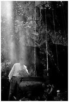 Urn and incense near the entrance of Phong Nha Cave. Vietnam (black and white)