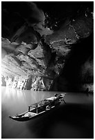 Boat inside the lower cave, Phong Nha Cave. Vietnam (black and white)