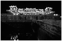 Ngo Mon (noon) Gate illuminated at night. Hue, Vietnam (black and white)