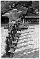 Row of statues and in Khai Dinh Mausoleum. Hue, Vietnam ( black and white)