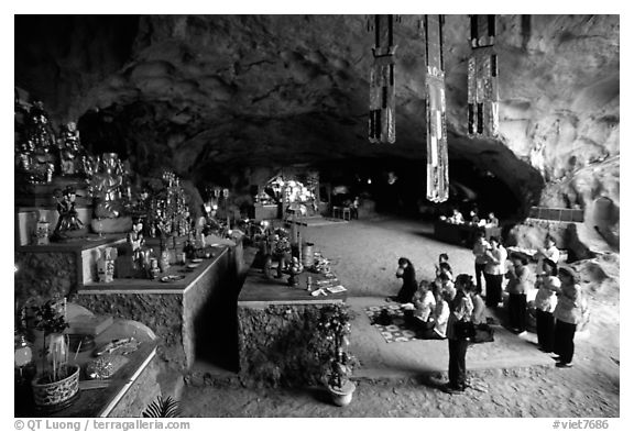 Group praying at the altar at the entrance of Tan Thanh Cave. Lang Son, Northest Vietnam