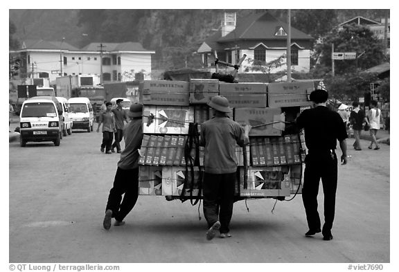 Bicyle loaded with an incredible amounts of goods from China at Dong Dang. Lang Son, Northest Vietnam (black and white)