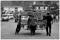 Bicyle loaded with an incredible amounts of goods from China at Dong Dang. Lang Son, Northest Vietnam (black and white)