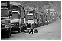 Trucks waiting to cross the border into China at Dong Dang. Lang Son, Northest Vietnam ( black and white)