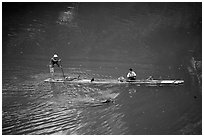 Crossing the Ky Cung  River on a narrow dugout boat. Northest Vietnam (black and white)
