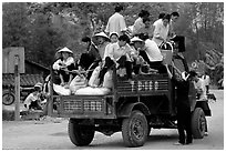 Riding in the back of an overloaded truck. Northest Vietnam ( black and white)