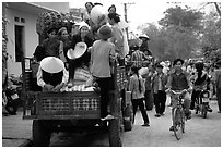 Riding in the back of an overloaded truck. Northest Vietnam (black and white)