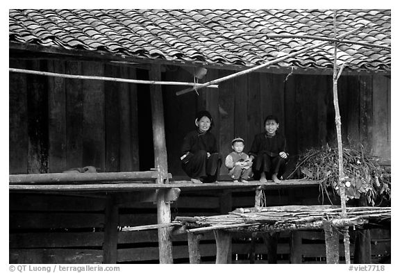 Women and child of the Nung ethnicity in front of their home. Northeast Vietnam (black and white)