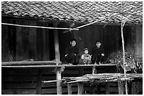 Women and child of the Nung ethnicity in front of their home. Northeast Vietnam (black and white)