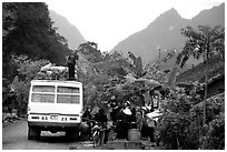Unloading of a bus in a mountain village. Northeast Vietnam ( black and white)