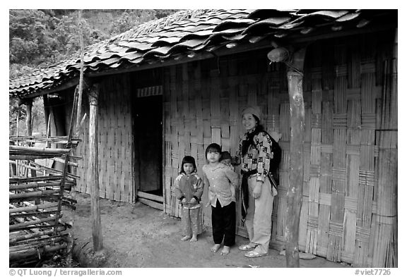 Family outside their home. Northeast Vietnam (black and white)