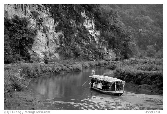 Shallow boats transport villagers to a market. Northeast Vietnam (black and white)