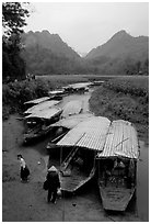 Boats waiting for villagers at a market. Northeast Vietnam (black and white)