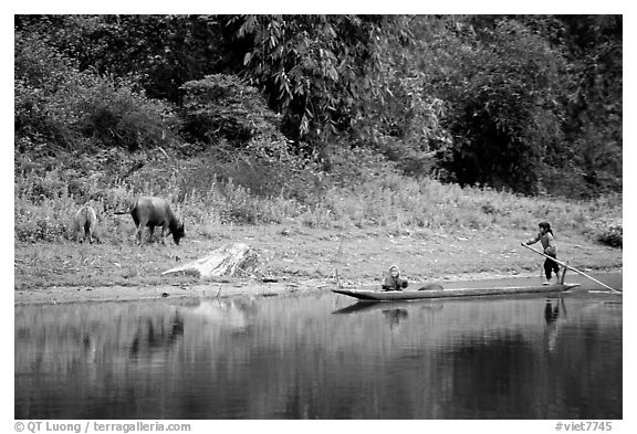 Children on a dugout boat. Northeast Vietnam (black and white)