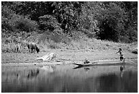 Children on a dugout boat. Northeast Vietnam ( black and white)