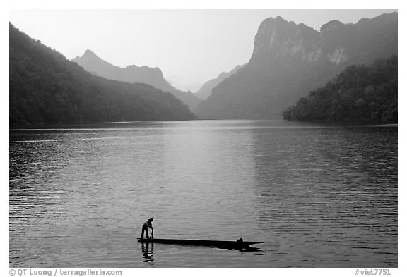 Fisherman on Dugout boat,  Ba Be Lake. Northeast Vietnam