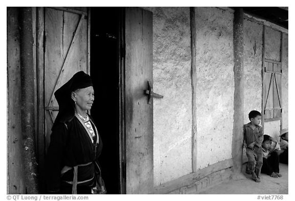 Elderly  tribewoman outside her house, near Mai Chau. Northwest Vietnam (black and white)