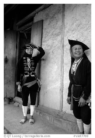 Two generations of tribewomen outside their house, near Mai Chau. Northwest Vietnam (black and white)