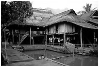 Stilt houses with thatched roofs of Ban Lac village. Northwest Vietnam (black and white)