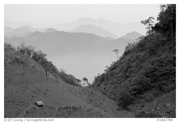 House and misty ridges between Moc Chau and Yeu Chau. Northwest Vietnam (black and white)