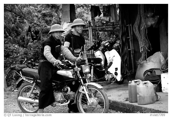 Two Hmong motorcyclists at the Xa Linh market. Northwest Vietnam (black and white)