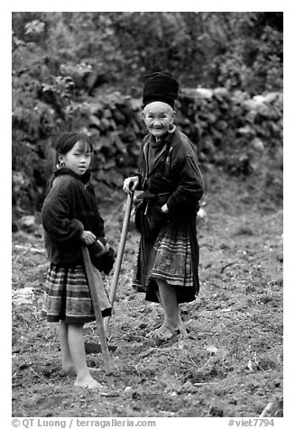 Elderly tribeswoman and girl doing field work  near Yen Chau. Northwest Vietnam (black and white)