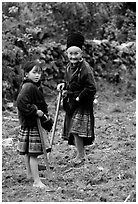 Elderly tribeswoman and girl doing field work  near Yen Chau. Northwest Vietnam (black and white)