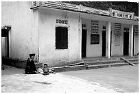 Hmong woman and child at a village hospital near Yen Chau. Northwest Vietnam ( black and white)