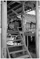 Elderly Montagnard man wearing the French beret on his porch, near Son La. Northwest Vietnam ( black and white)