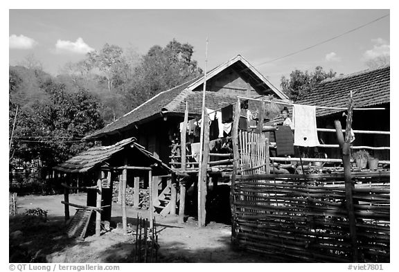 Woman drying laundry in a montagnard village near Son La. Northwest Vietnam