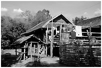 Woman drying laundry in a montagnard village near Son La. Northwest Vietnam (black and white)