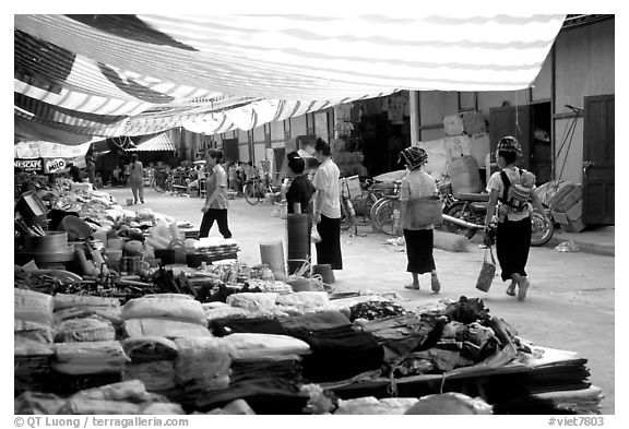 Thai women walk in a town market, near Son La. Northwest Vietnam (black and white)