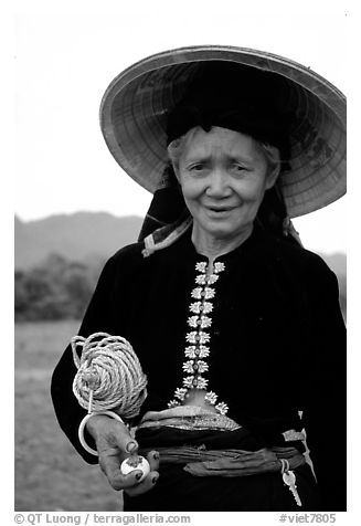 Thai woman wearing her traditional dress under the Vietnamese conical hat, near Son La. Northwest Vietnam