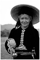 Thai woman wearing her traditional dress under the Vietnamese conical hat, near Son La. Northwest Vietnam (black and white)