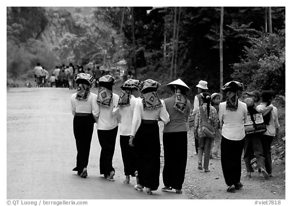 Young thai women walking on the road, between Son La and Tuan Chau. Northwest Vietnam