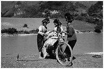 Thai women loading a bicycle, near Tuan Giao. Northwest Vietnam (black and white)