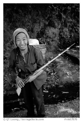 Hunter holding an old rifle, near Lai Chau. Northwest Vietnam (black and white)