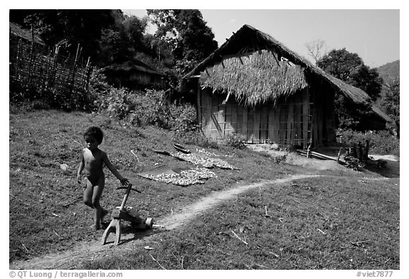 Unclothed child in a minority village, between Lai Chau and Tam Duong. Northwest Vietnam (black and white)