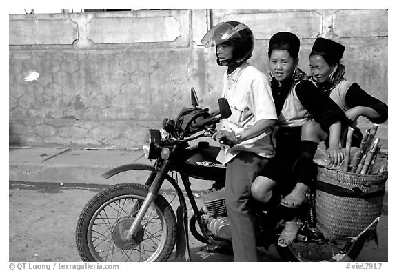 Black Hmong Women riding at the back of a Russian motorbike. Sapa, Vietnam (black and white)