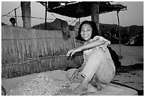 Girl drying shrimp. Ha Tien, Vietnam (black and white)