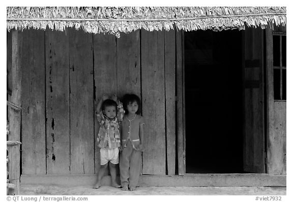 Two kids in front of a hut. Hong Chong Peninsula, Vietnam (black and white)