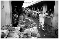 Vegetables for sale in an alley of the Ben Than Market. Ho Chi Minh City, Vietnam (black and white)