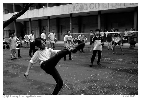 Students playing foot-only volley-ball in a school courtyard. Ho Chi Minh City, Vietnam