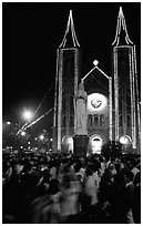 Crowds gather at the Cathedral St Joseph for Christmans. Ho Chi Minh City, Vietnam (black and white)