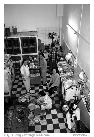 Women in a home kitchen. Ho Chi Minh City, Vietnam (black and white)