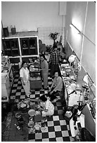 Women in a home kitchen. Ho Chi Minh City, Vietnam (black and white)