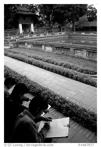 Art students drawing in the Temple of the Litterature. Hanoi, Vietnam (black and white)